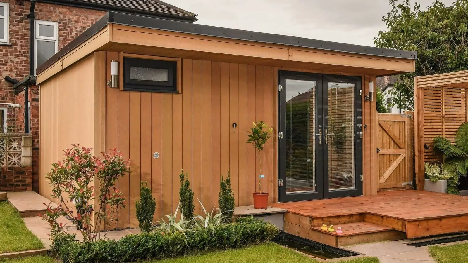 Garden room at the end of a lawn