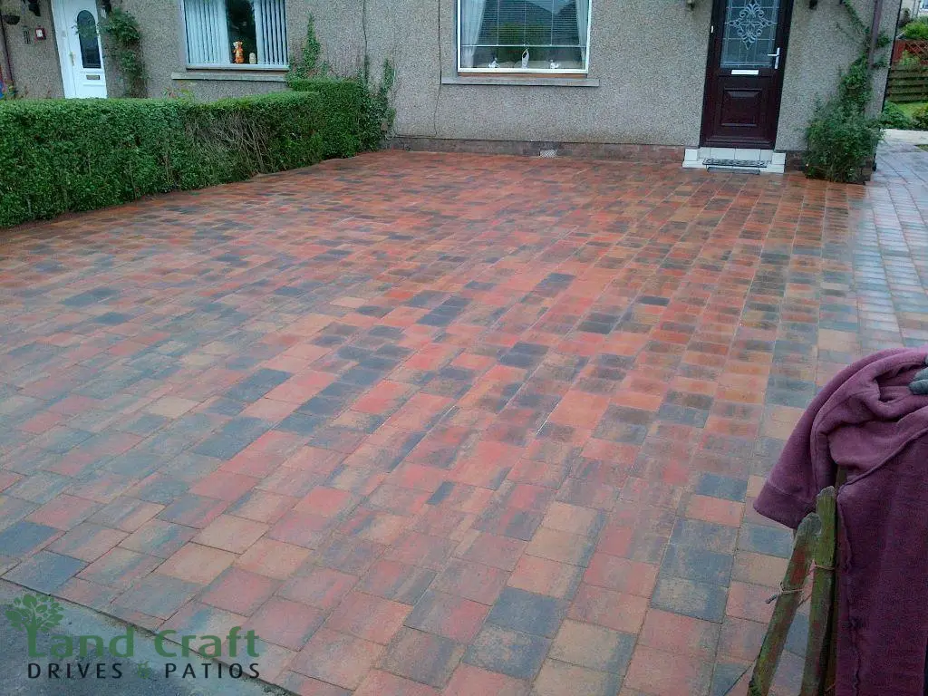 Brindle block paving driveway outside a brick house