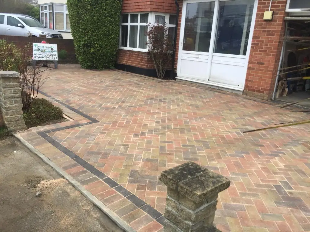 Brindle block paved front garden with a charcoal border