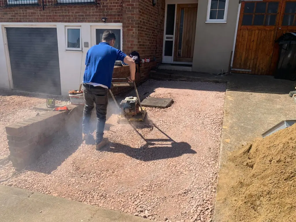 Sub-base being compacted for a new driveway