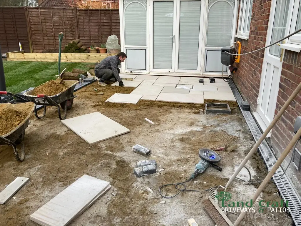 Porcelain paving being laid outside patio doors