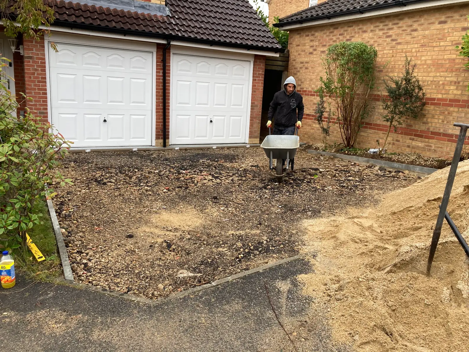 Groundworks under way in front of a double garage