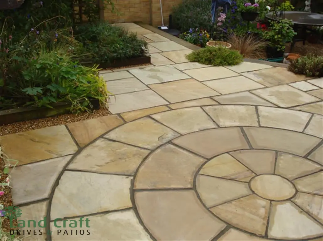 Indian sandstone patio with a circular feature