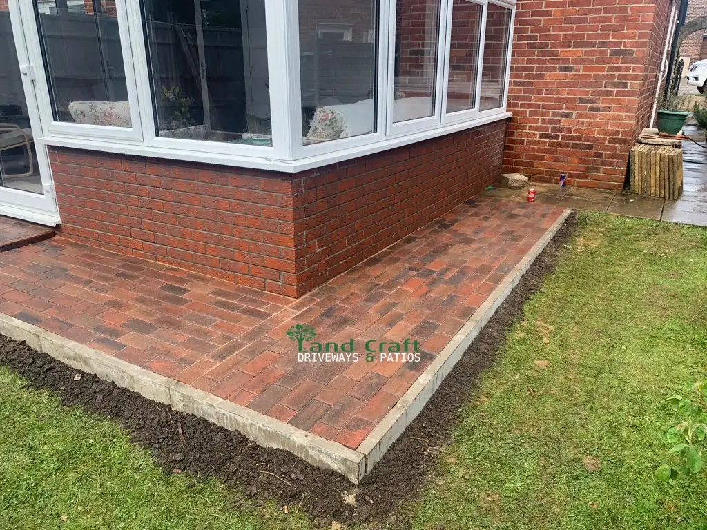 Red block paving around a conservatory